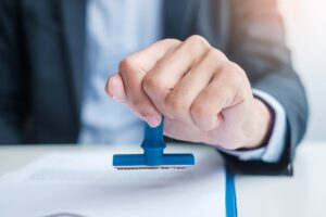 Businessman stamp during signing contract document.Business contract, approve, partnership, contract